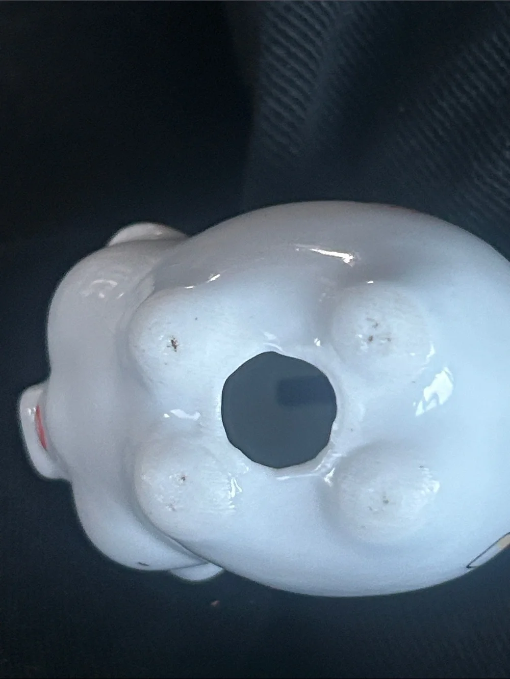 This vintage porcelain piggy bank features a German Good Luck) chimney sweep